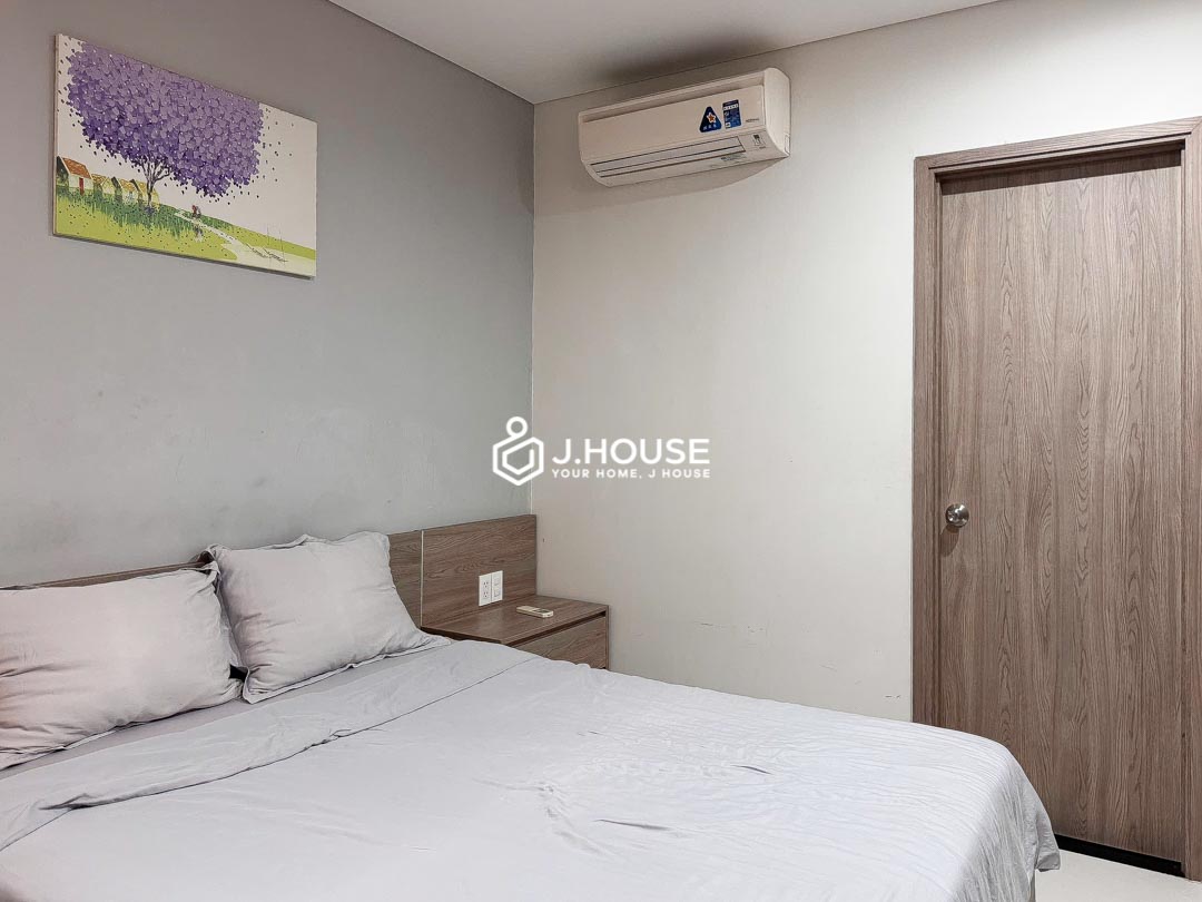 Cozy bedroom opening to skylight at KHouse District 1