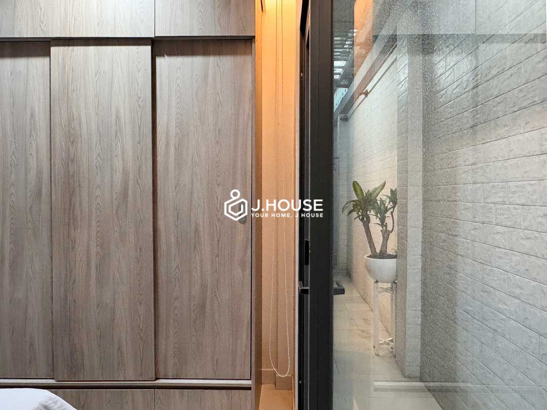 Cozy bedroom opening to skylight at KHouse District 1