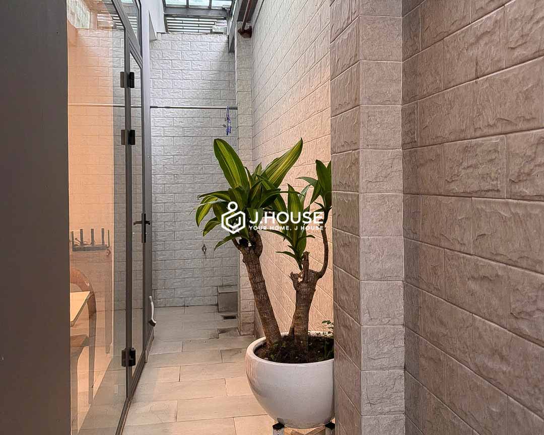 Private rear courtyard and skylight in Ben Nghe apartment